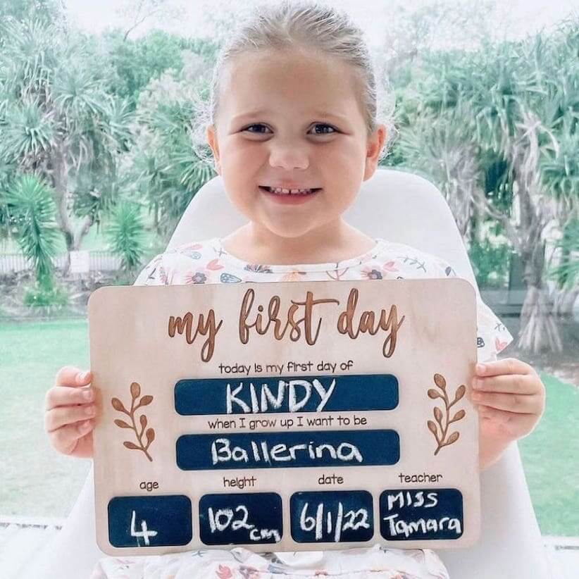 Girl holding First Day of School Wooden Board