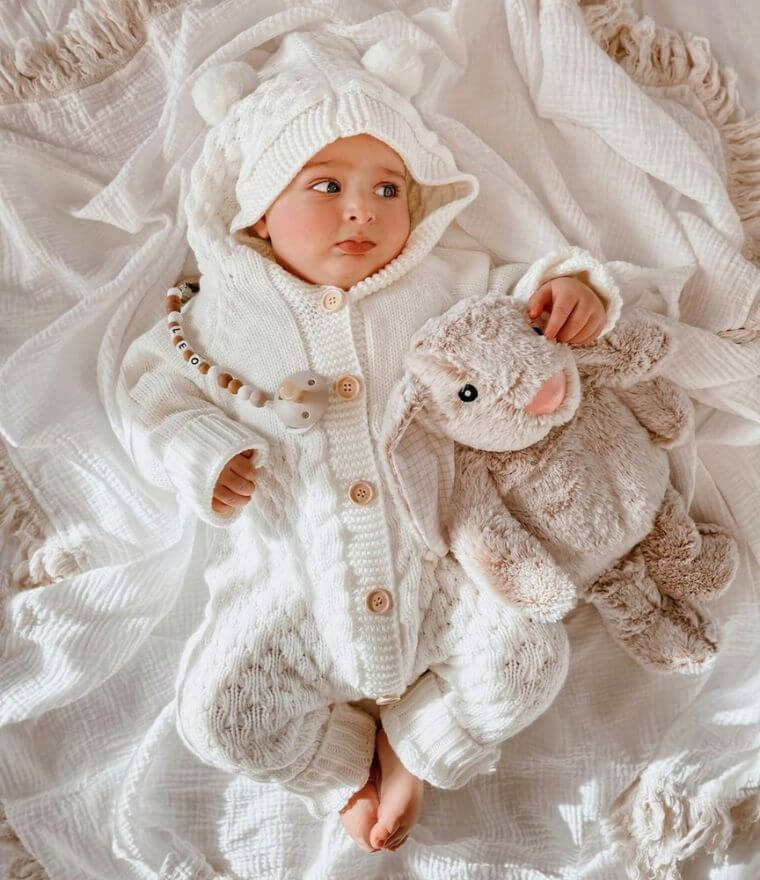 Baby Boy wearing out knit baby bear onesie in white