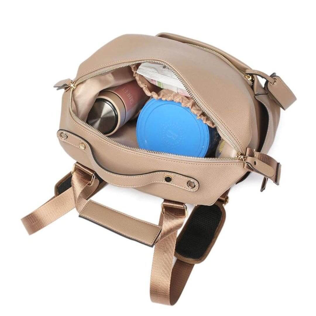 Penelope Nappy Bag in camel - top view showing the backpack open and packed