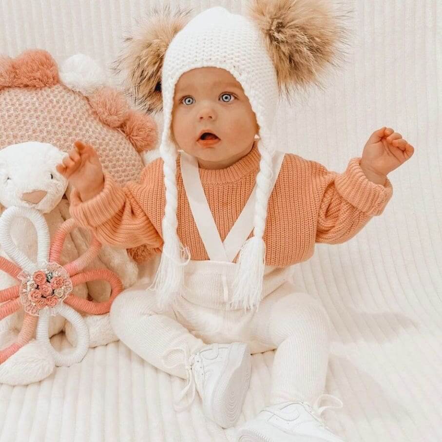 Baby girl wearing creamy white ribbed suspender tights - Lulu Babe