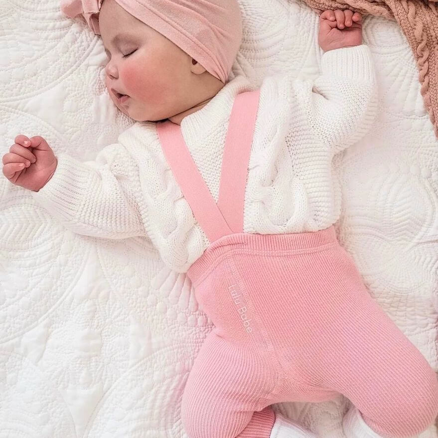 Baby girl wearing pink ribbed suspender tights - Lulu Babe