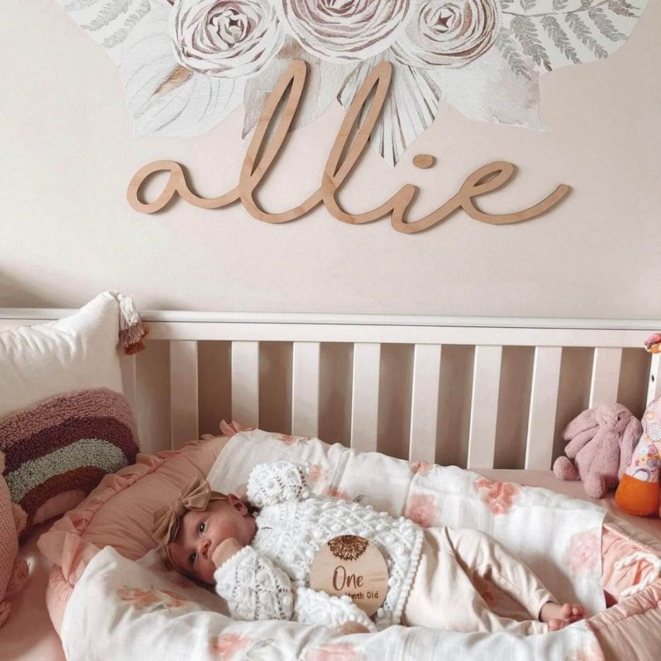 Personalised wooden name sign hung above baby's cot - from Lulu Babe