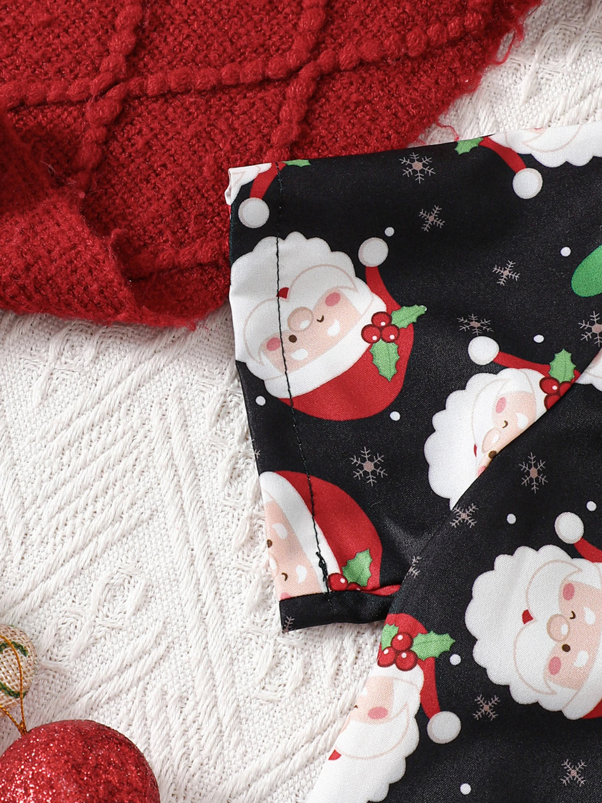 Close-up of Santa Suspenders Set featuring collared shirt with Santa prints, perfect baby boy Christmas outfit.