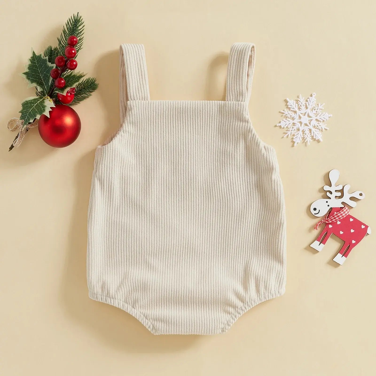 Fa La La Christmas Romper in cream corduroy, perfect for festive celebrations and baby outfits, laid on a neutral background.