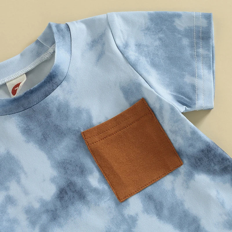 Close-up of short-sleeve tee with tan pocket detail from the Tie Dye Shorts Set