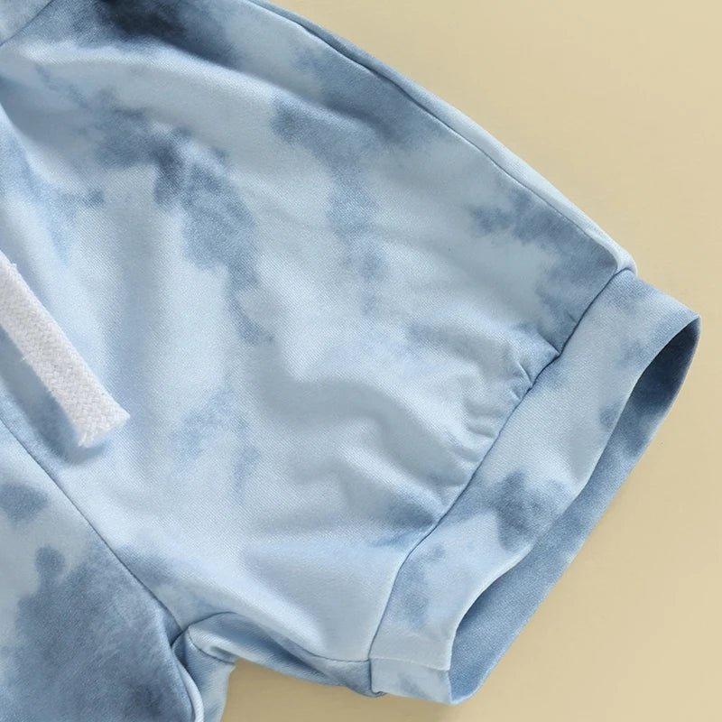 Close-up of the soft sleeve detail from the Tie Dye Shorts Set in blue tones, perfect for summer play.