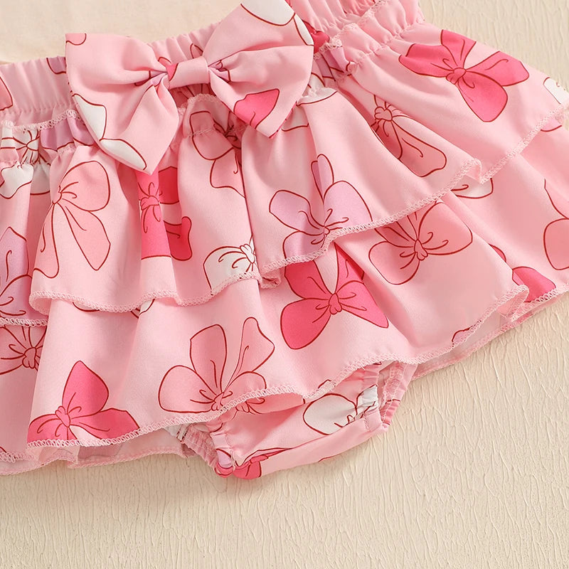Pink tiered bloomer skirt with bow print, perfect for baby girls' first Father's Day celebration.