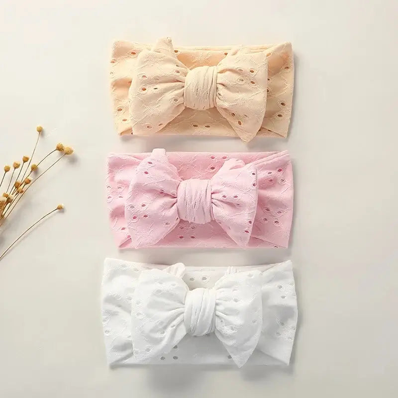 Nora Topknot Bow Headbands - shown in yellow, pink and white