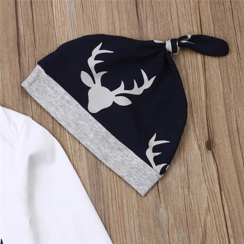 Comfy navy knotted beanie with deer antler print, matching grey band, perfect for baby's deer-themed outfit.