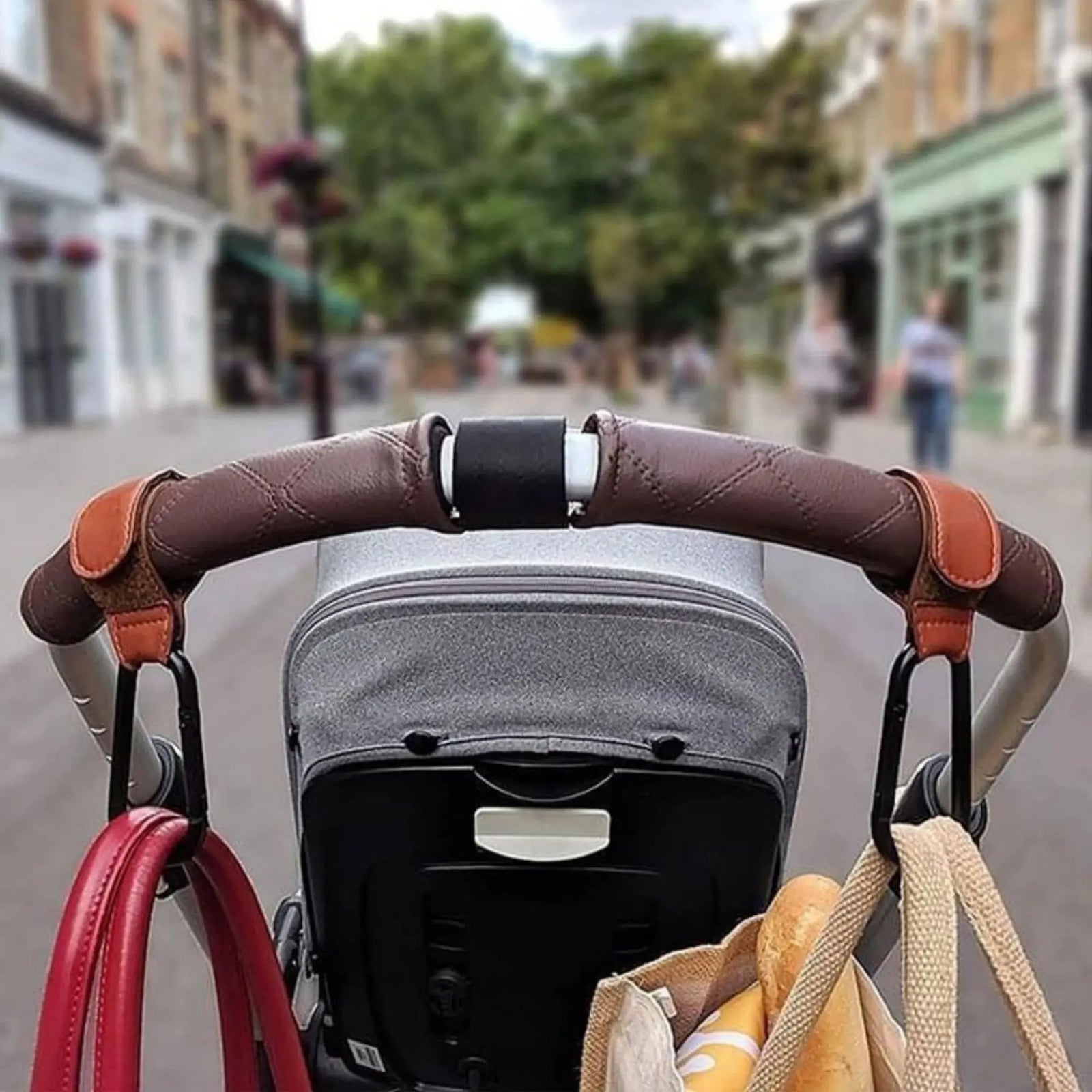 Universal Pram Clips attach easily to strollers with velcro for a stylish and premium vegan leather finish