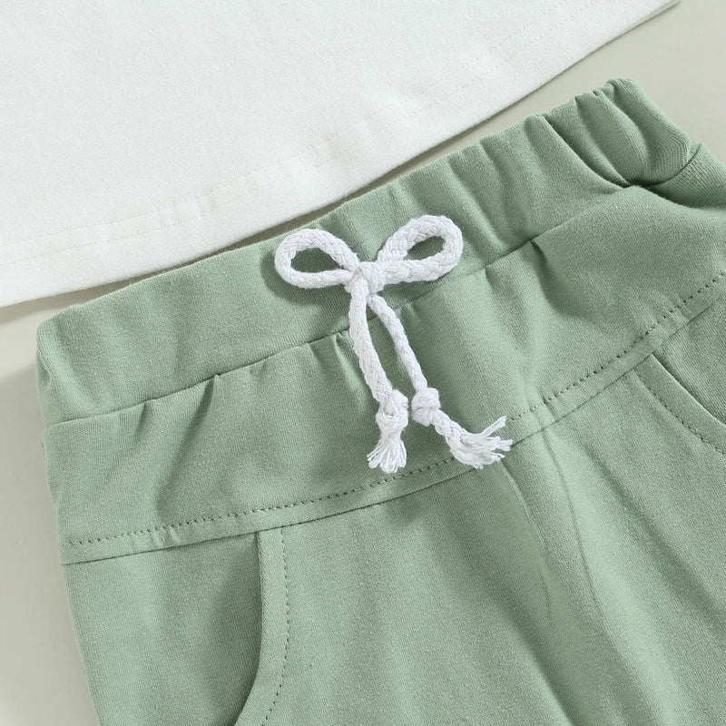 Fynn Colour Block Shorts Set featuring green shorts with contrast pockets and a white T-shirt, ideal for baby boys.