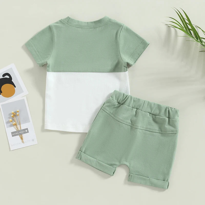 Fynn Colour Block Shorts Set featuring a short-sleeve t-shirt and shorts with pockets in a modern green and white design.
