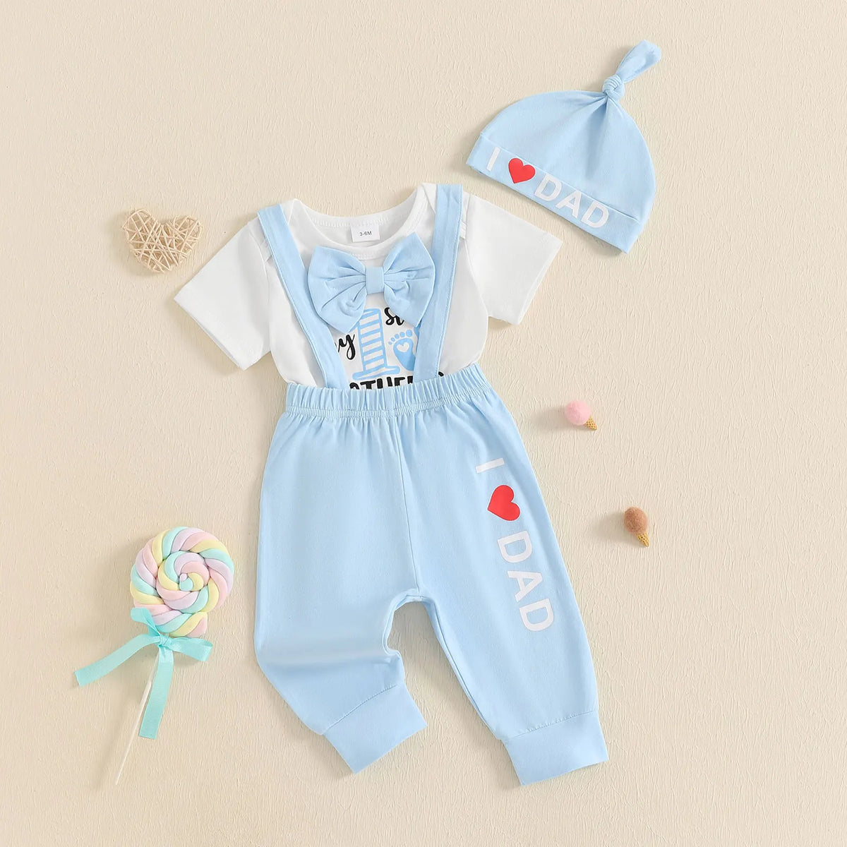 Adorable My 1st Father's Day suspender set for babies, featuring a bow tie, bodysuit, and beanie hat.