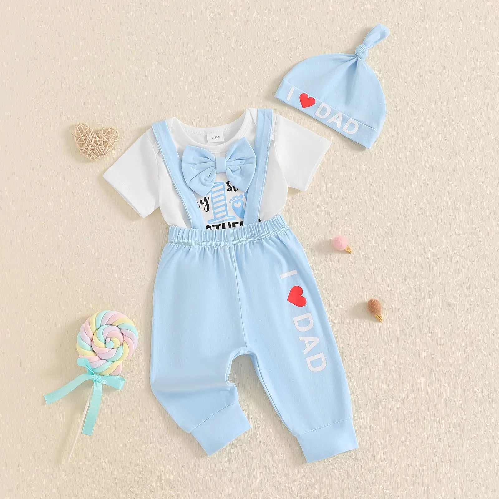 Adorable My 1st Father's Day suspender set for babies, featuring a bow tie, bodysuit, and beanie hat.