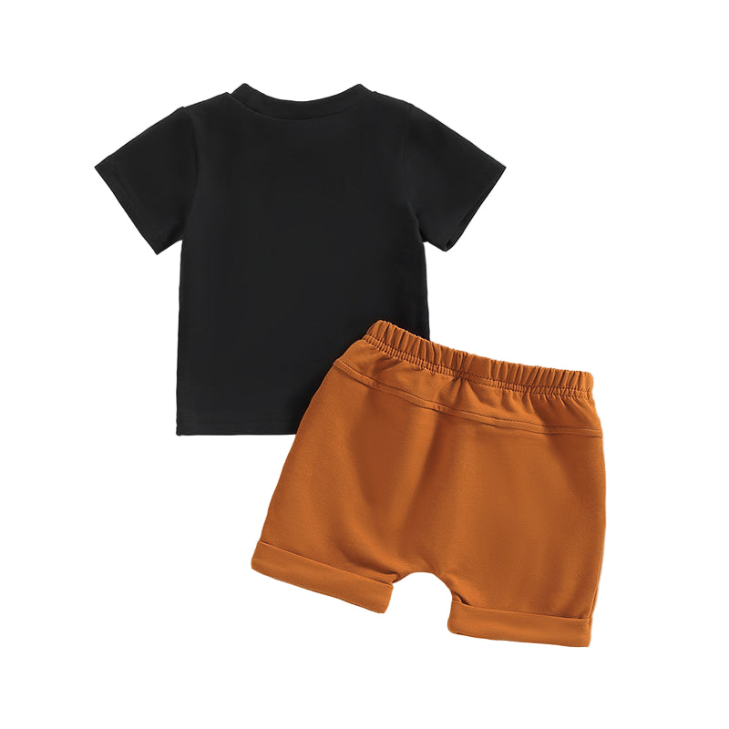 Just a Boy Who Loves Dinosaurs Set featuring a black t-shirt and tan shorts for boys aged 0-3 years.