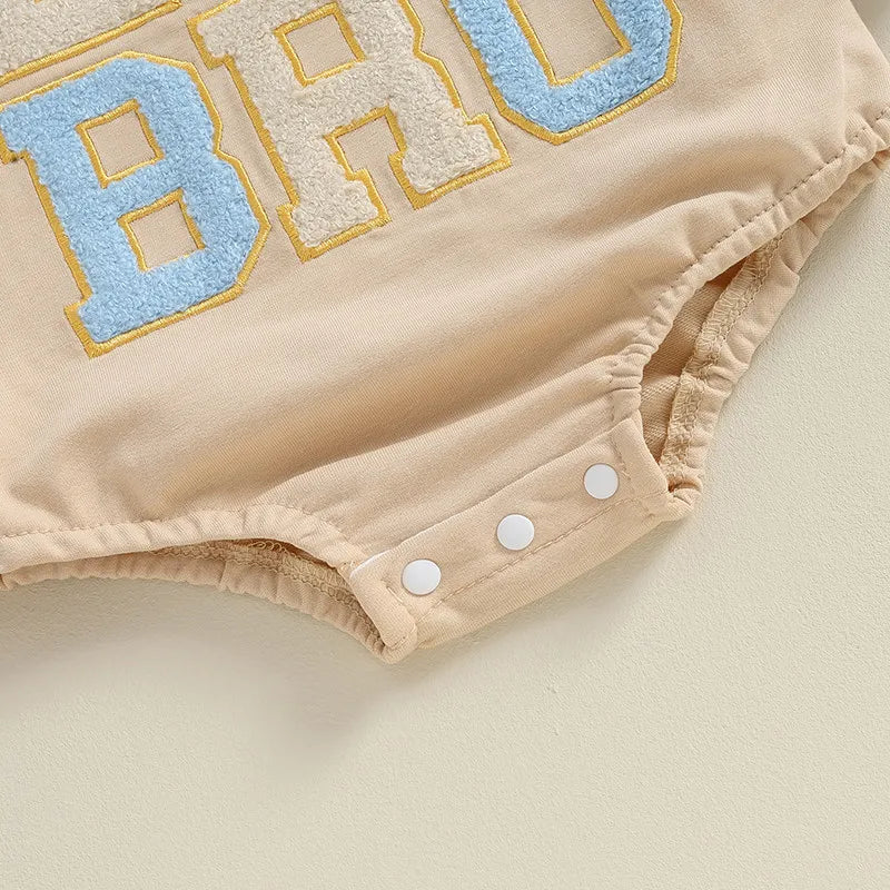 Close-up of the Lil Bro Long Sleeve Romper showcasing the playful 'BRO' applique and snap buttons.