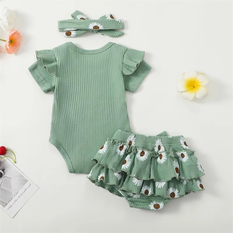Auntie's Bestie baby girl outfit in green - flatlay showing the back