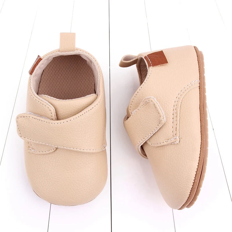 Cream vegan leather baby shoes with flexible sole, perfect for pre-walkers and early walkers.
