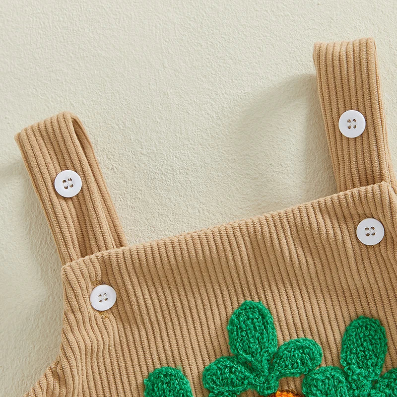 Tan corduroy baby romper with three textured carrot appliqués on front