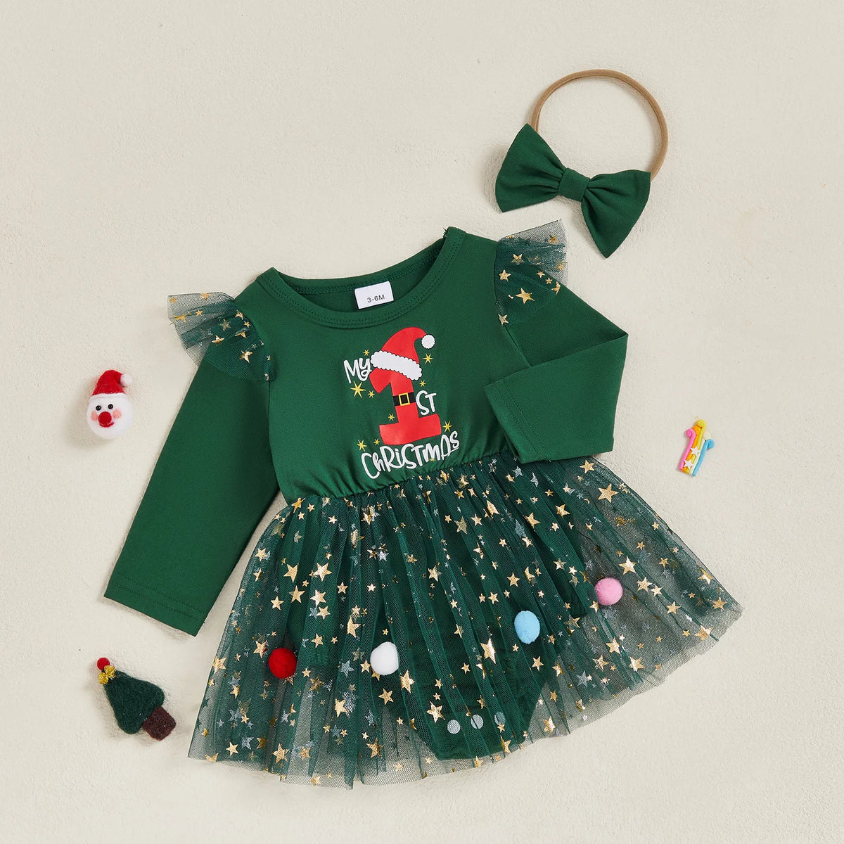 My 1st Christmas Star Tutu Dress for baby girl, festive green dress with Santa hat detail, glittery tutu and colourful pom-poms.