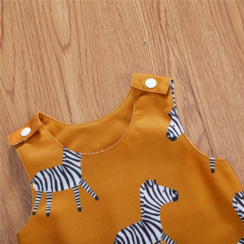 Close-up of mustard zebra onesie for babies, featuring a vibrant yellow base and playful zebra print design.