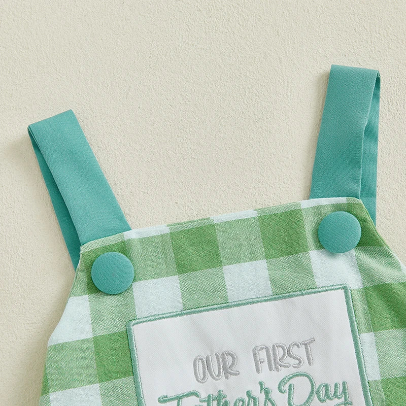 Green and white gingham romper for first Father's Day with embroidered patch and button straps.