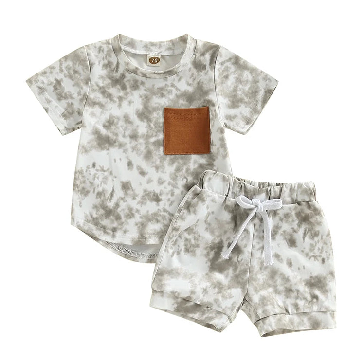 Baby Boy Tie Dye Shorts Set featuring a short-sleeve tee with a chest pocket and matching elastic-waist shorts in grey tones.
