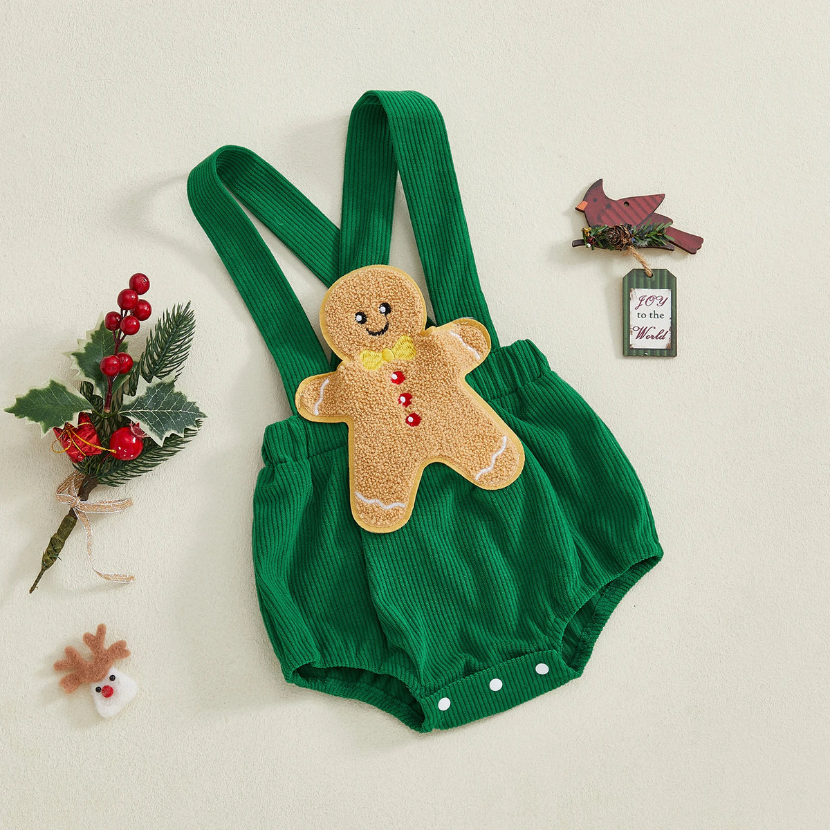Gingerbread man romper in vibrant green corduroy, ideal Christmas baby outfit for festive celebrations.