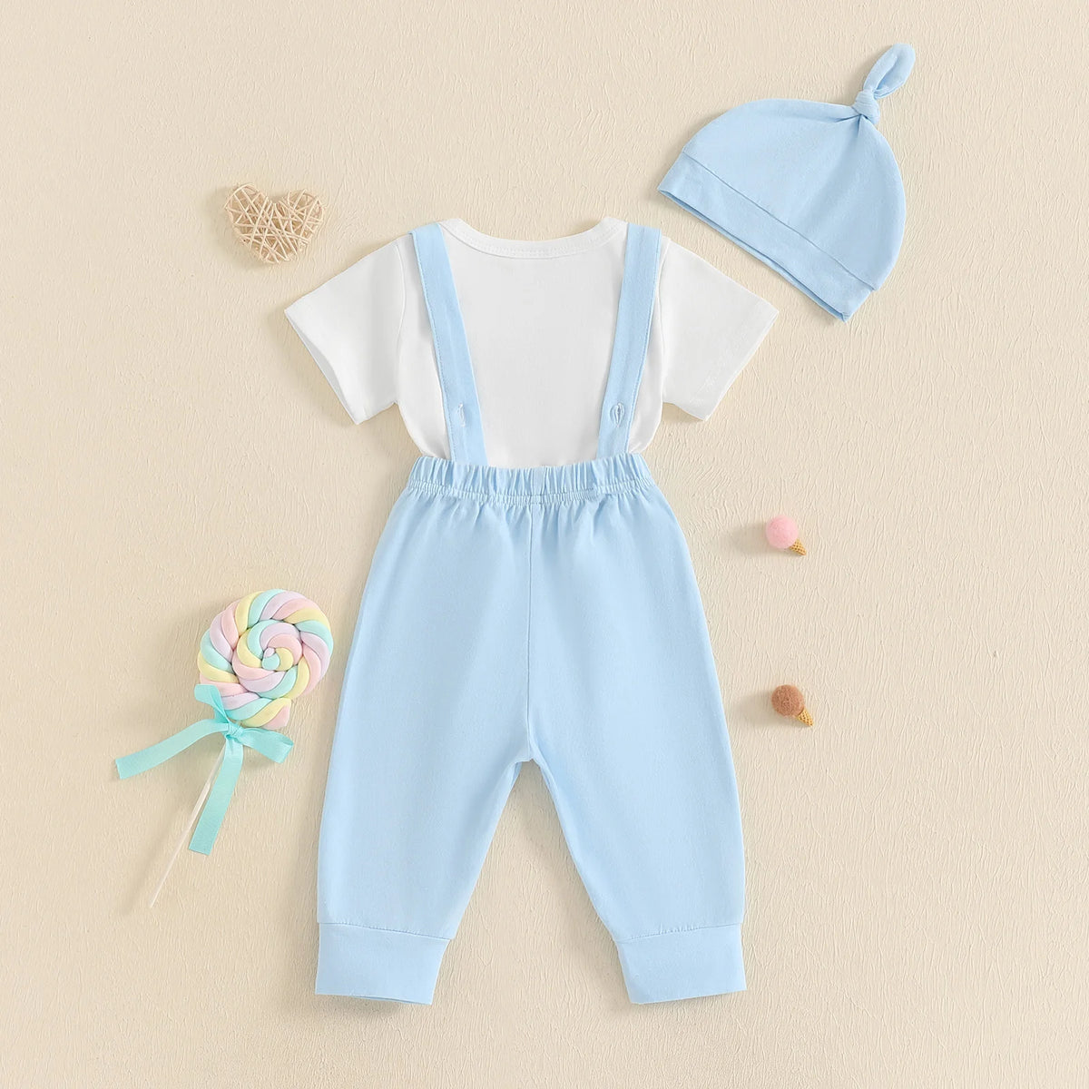 Adorable 1st Father’s Day suspender set with white bodysuit, blue pants, and matching beanie hat