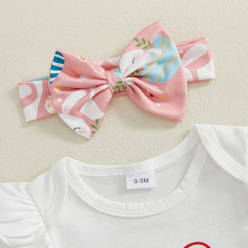 Flatlay of my first Easter baby outfit showing bow headband