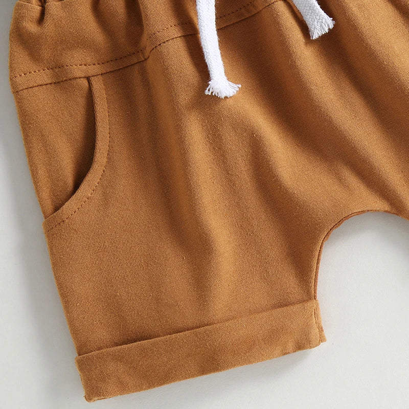 Light brown elasticated shorts with pockets and drawstring for kids, part of the Chicken Nugs & Mama Hugs set.