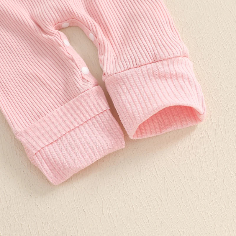 Close-up of Daddy's Girl pink ribbed onesie cuffs showcasing soft texture and snap buttons.