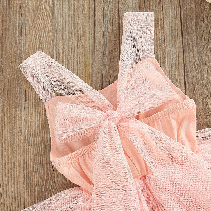 Ballerina Tutu Romper featuring adjustable shoulder straps with a bow and a soft dotted bodice for baby girls.