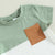 Fynn Colour Block Shorts Set T-shirt with contrast pocket in green and brown, perfect for baby and toddler boys.