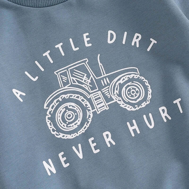 Close-up of the tractor graphic and "A Little Dirt Never Hurt" text on the blue pullover