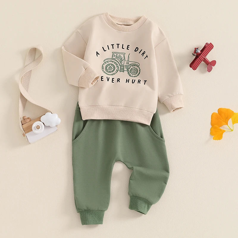 Full view of the beige "A Little Dirt Never Hurt" pullover and matching green tracksuit bottoms, laid flat