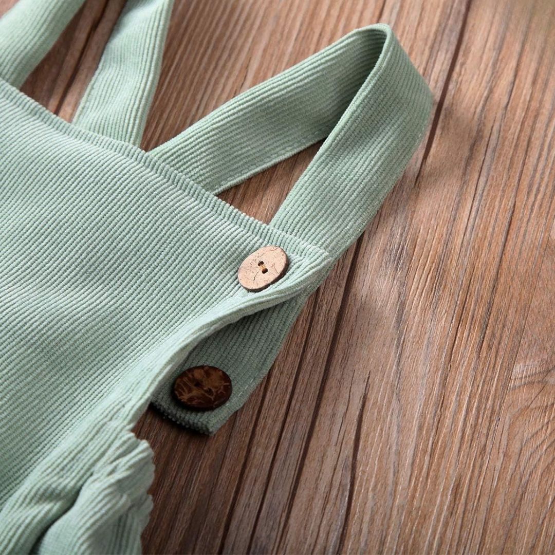 Alex Baby Romper in mint green corduroy - showcasing adjustable straps