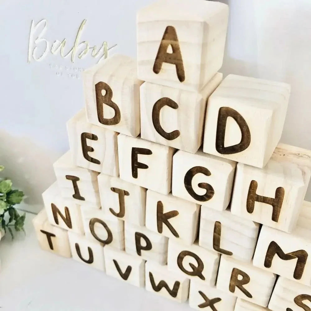 Wooden Alphabet Blocks arranged in a creative display, perfect for early literacy and playful learning.