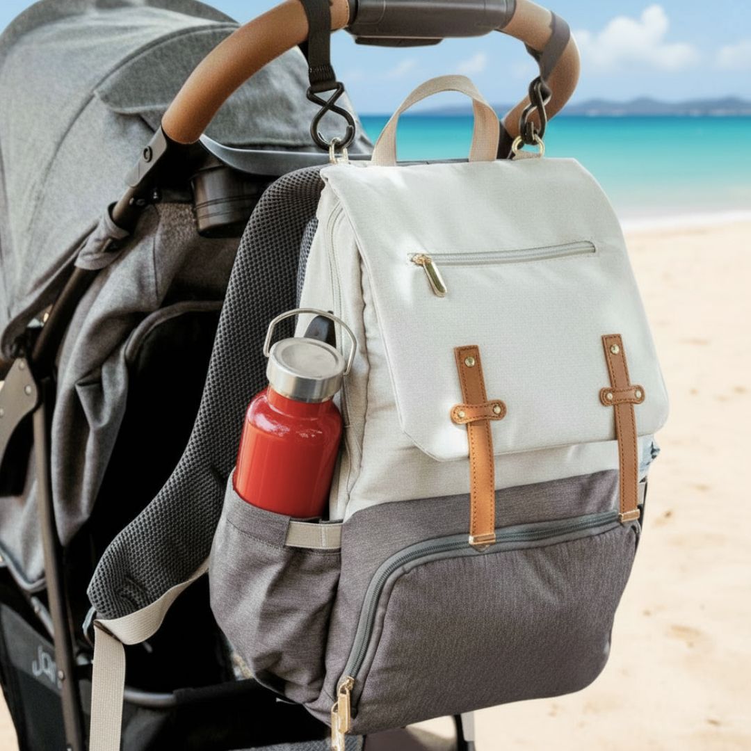 Stylish unisex nappy backpack in white and grey, attached to a pram - Lulu Babe