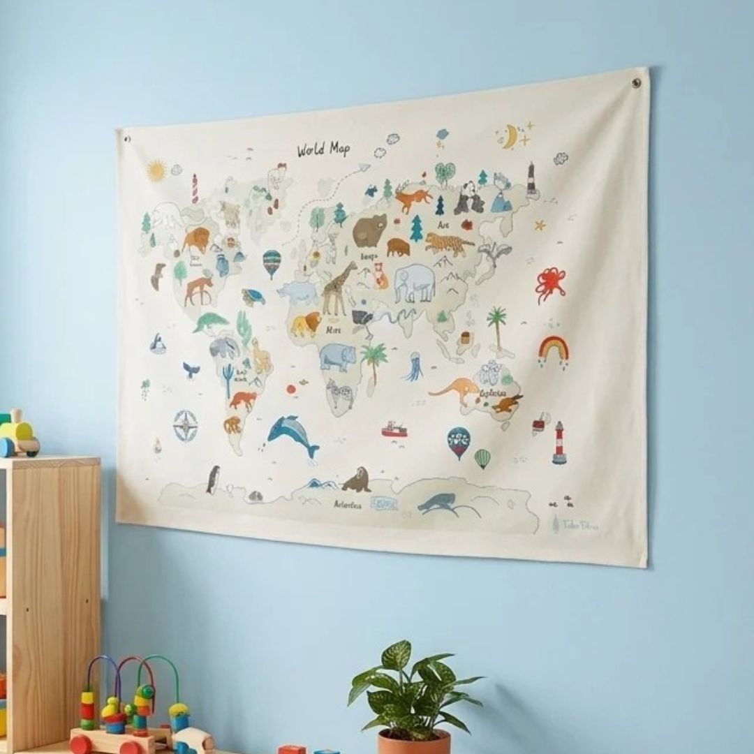Canvas world map wall hanging in large size, with colourful animal and landmark illustrations, displayed on a light blue wall in a children's room