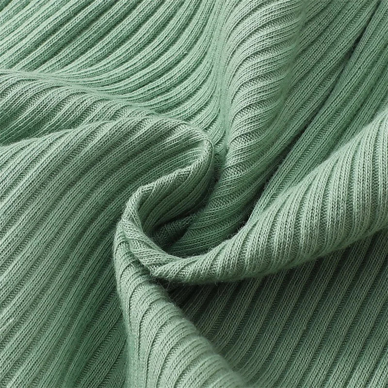 Auntie's Bestie baby girl outfit in green - closeup of ribbed fabric