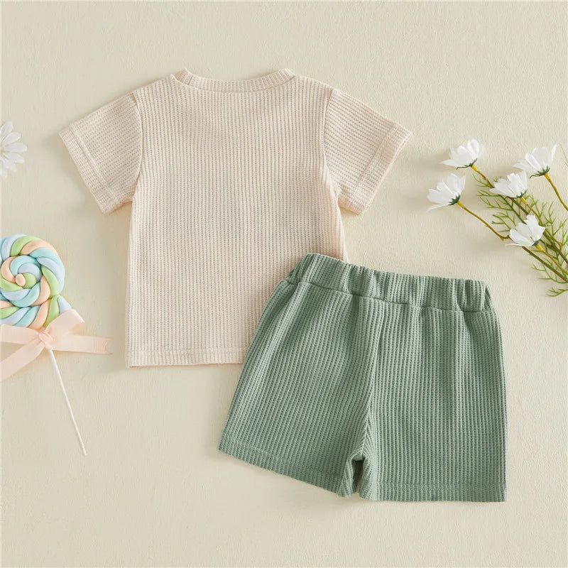 Auntie's Lil Dude baby outfit with cream tee and green shorts