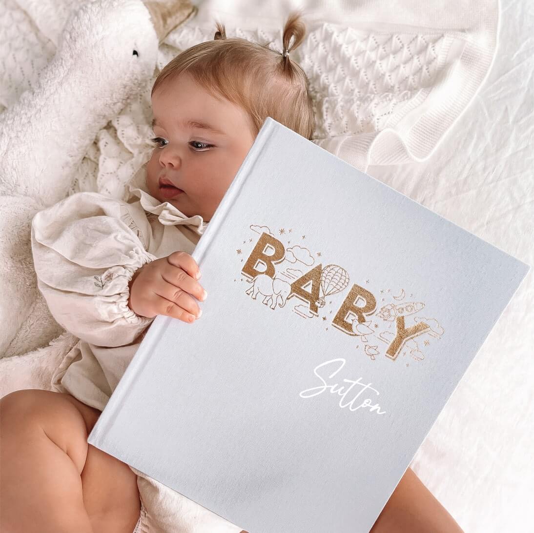 Baby holding Memory Book in powder | Personalised Baby Keepsake Journal for Milestones