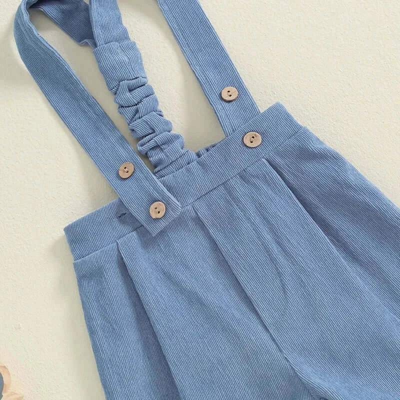 Closeup of blue suspenders from Remi Baby Bow Tie Set