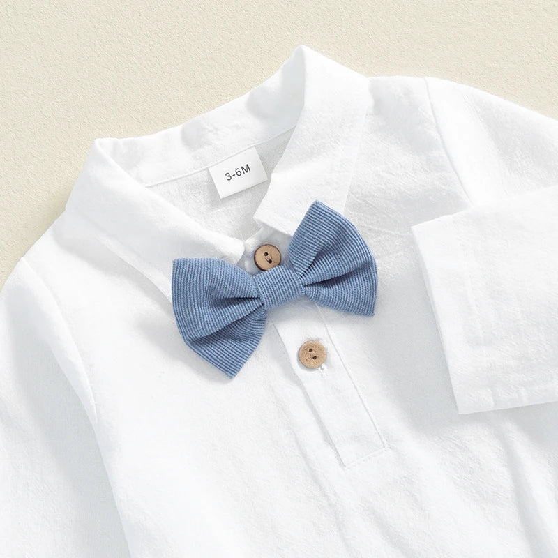 Formal baby boy outfit showing white collared shirt onesie with blue bow tie