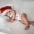 Sleeping baby boy wearing the Reindeer Corduroy Romper - a cute Christmas baby outfit