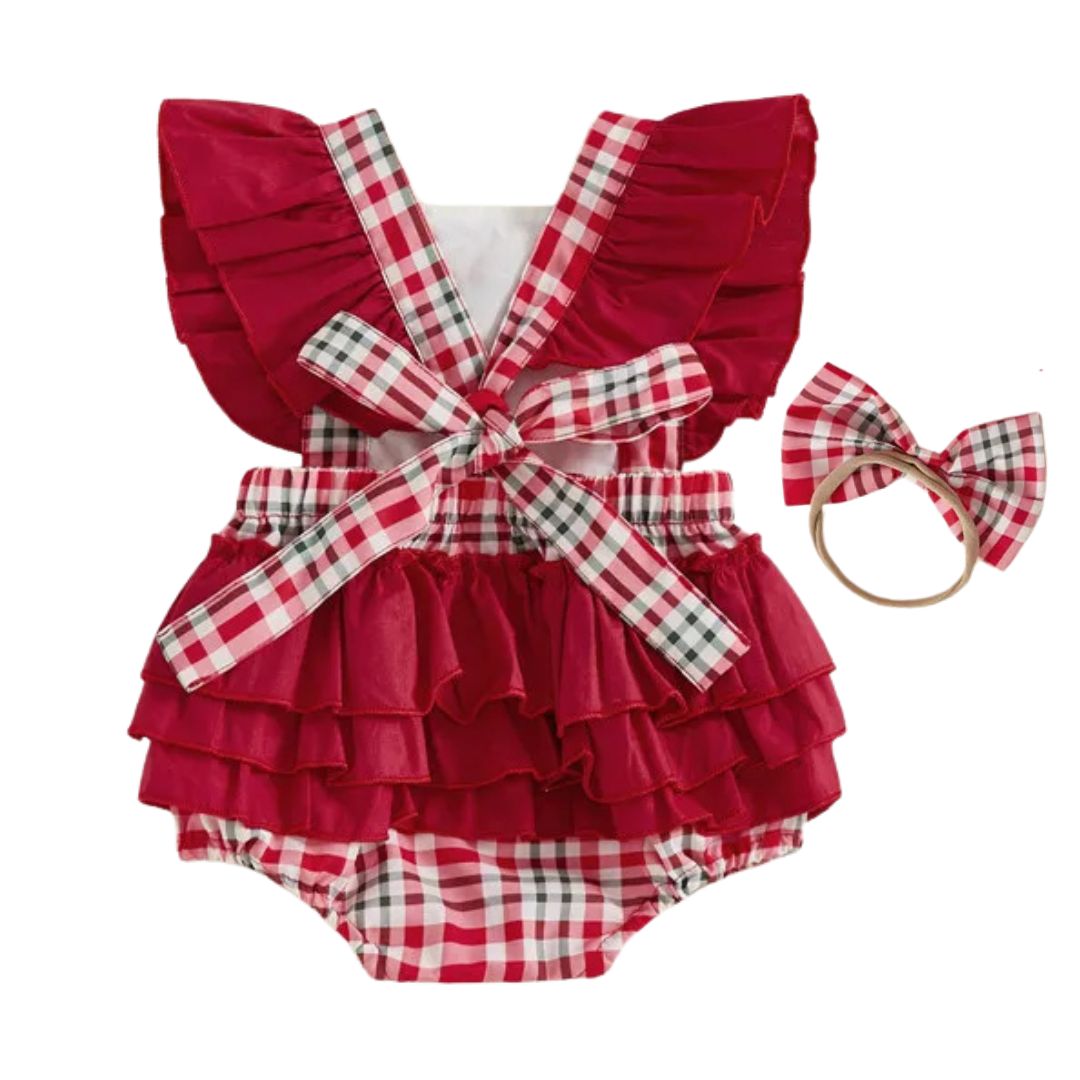Back of red tartan baby Christmas romper with crossed shoulder straps and layered ruffles