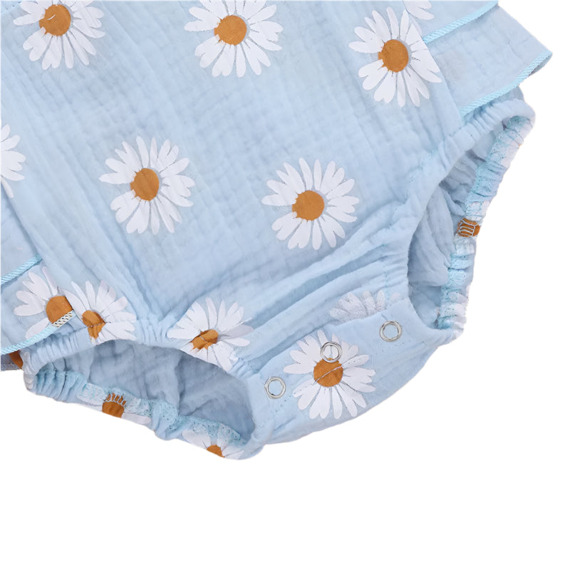 Daisy Ruffle Romper in blue | closeup of fabric and snap closure