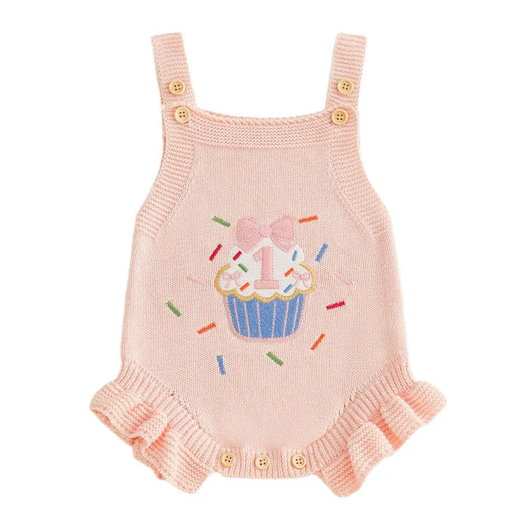 Pink knitted baby girl romper with cupcake design for first birthday