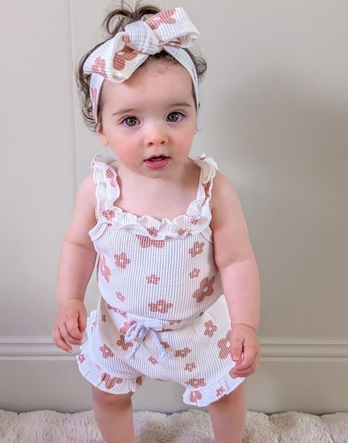 Baby girl wearing floral waffle outfit in white for 0-18 months